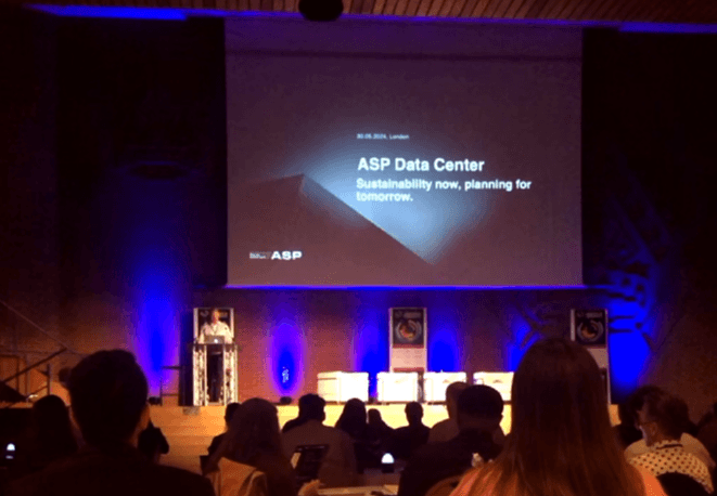 Asp Data Center presenting at the AI World Congress in London, with the title slide “Sustainability now, planning for tomorrow”