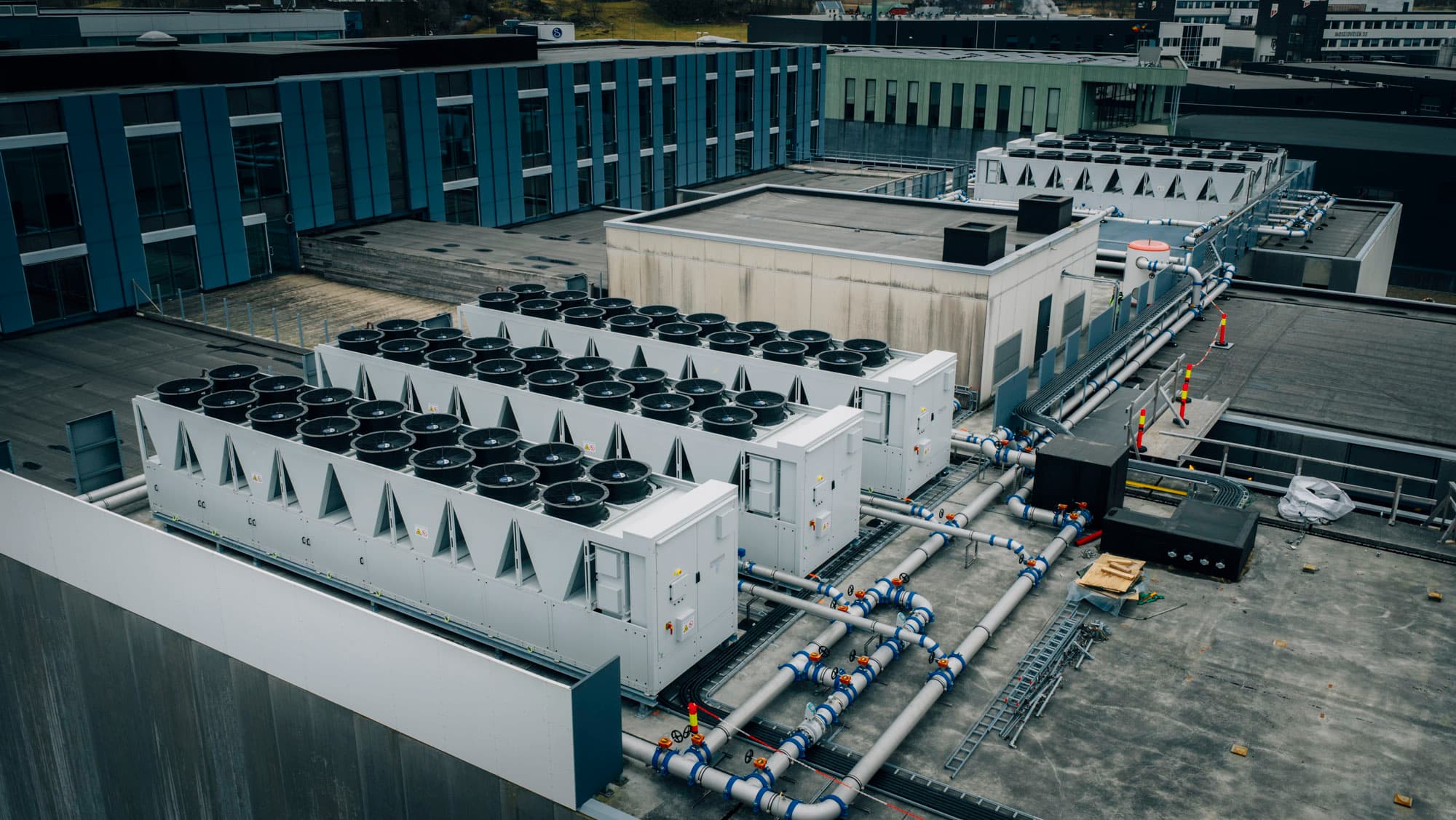Aerial view of the rooftop cooling units and pipework at the K11 data center