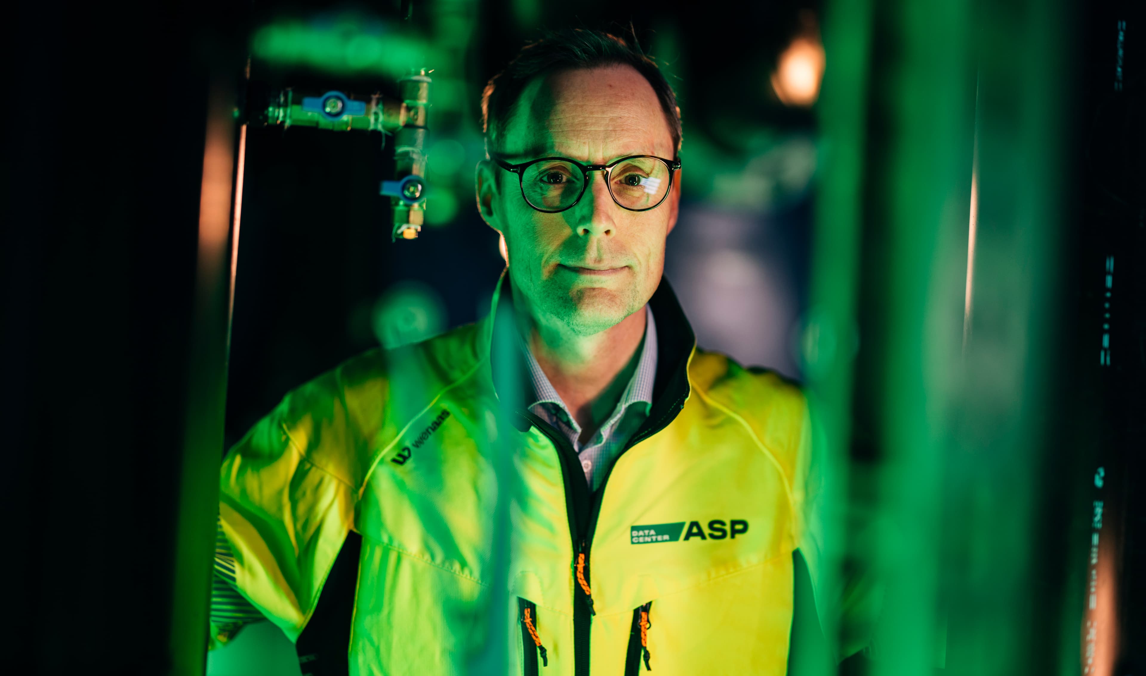 An ASP Data Center engineer in a server hall