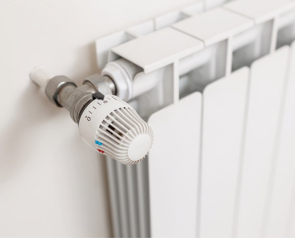 Thermostat valve on a white radiator