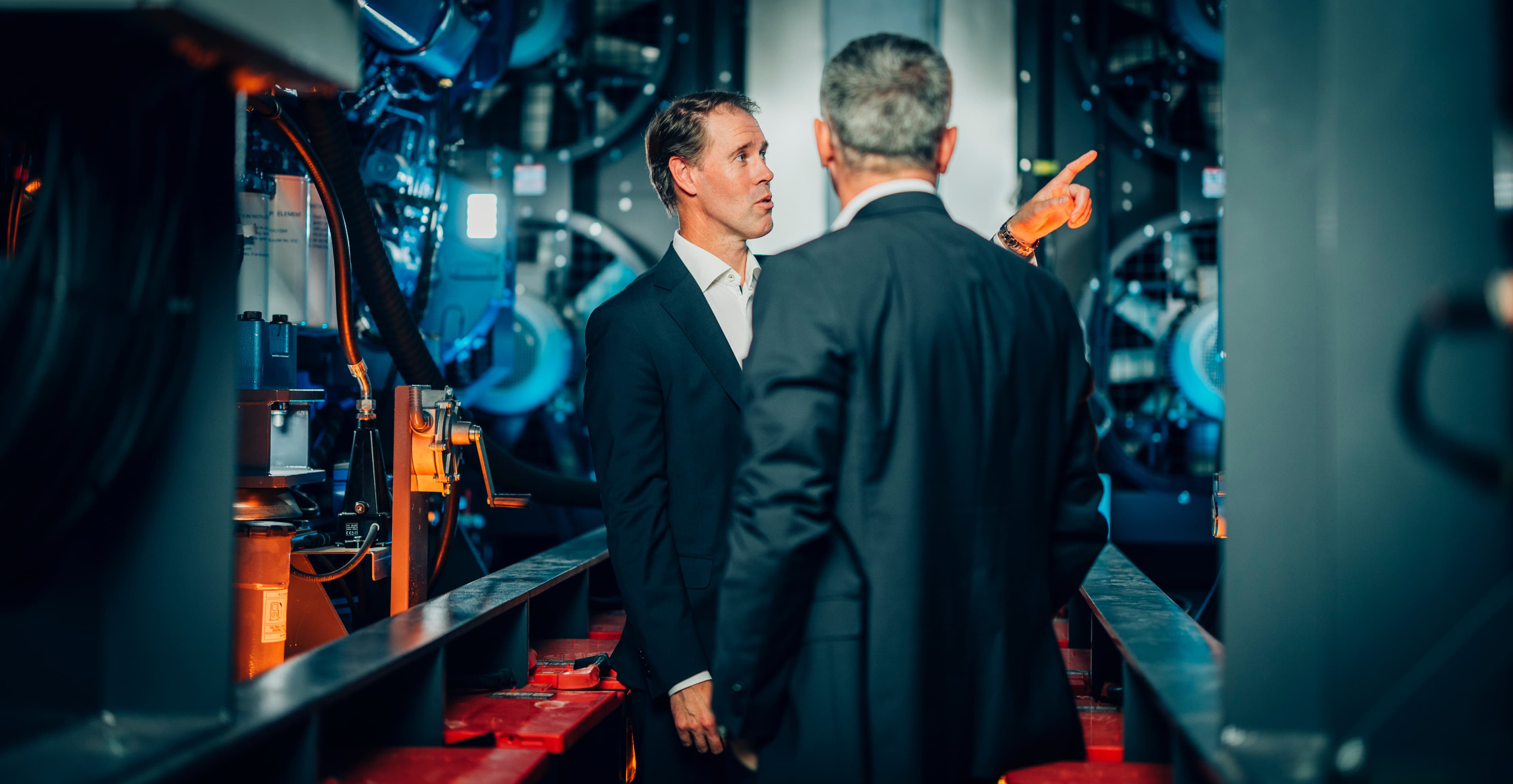 Two colleagues talking inside an ASP data center hall